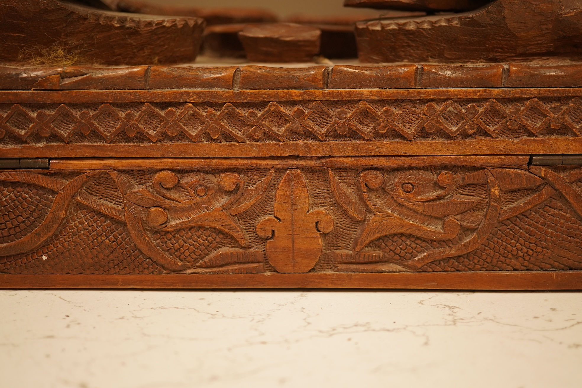A late 19th century Japanese gilt metal lidded box together with a Burmese carved hardwood box, 28cm wide